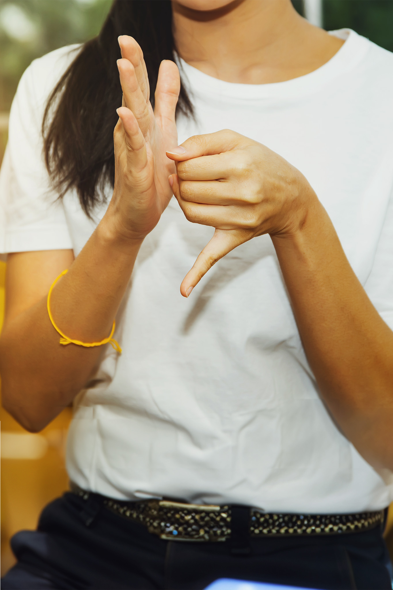 woman making hand signs